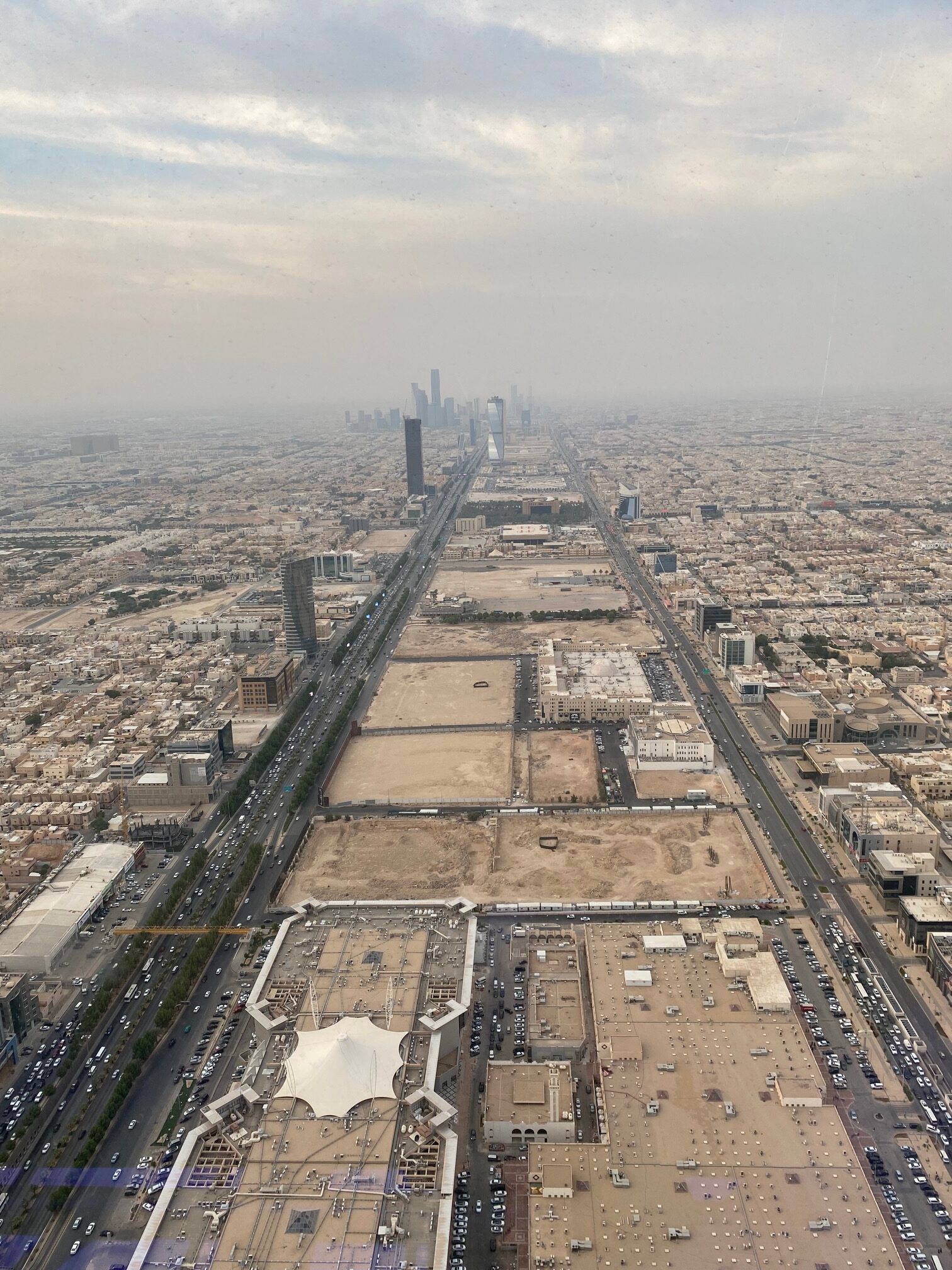 View from the Kingdom Tower toward the Business District with construction sites all the way toward the skyscrapers of the Business District on the far horizon